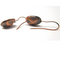 Beautiful crystal sparkling stones set in a brass base setting. The stone is faceted with brown, amber, green, and orange hues.